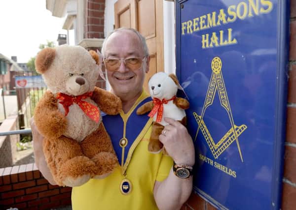 Freemason Kevin Carter holding Teddy Bears outside of the South Shields Masonic Hall. Picture by FRANK REID