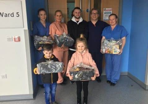 Chris McCormack and family members presented hampers to staff from the Royal Victoria Infirmary's burns unit to help other patients when they arrive at the unit.