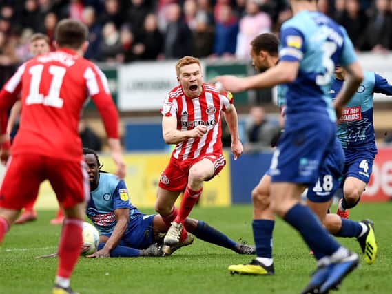 Duncan Watmore is injured by Marcus Bean at Wycombe.