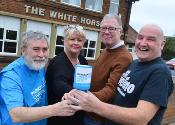 From left, John Shone from the South Shields branch of Parkinson's UK, Cath and Terry Power from The White Horse, and Graham Todd from Rivelino.