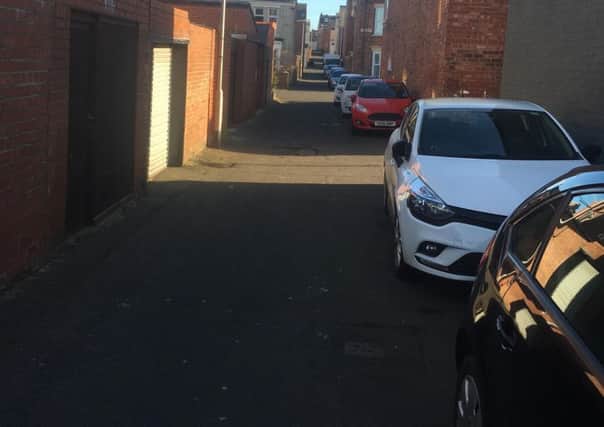 Cars parked in the back lane of Berkeley Street in South Shields.