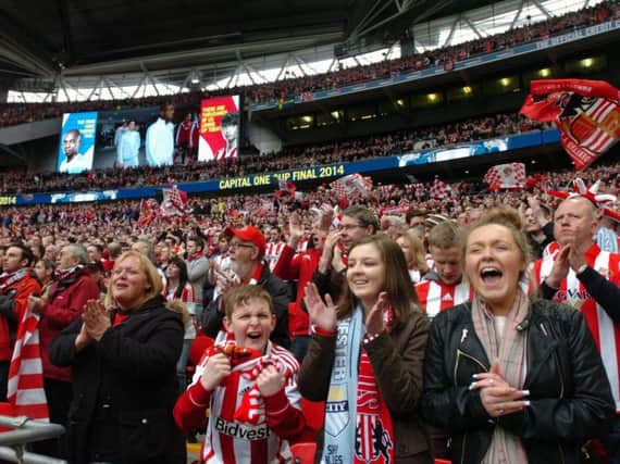 Supporters cheering on Sunderland at the Capital One Cup Final against Manchester City in 2014.