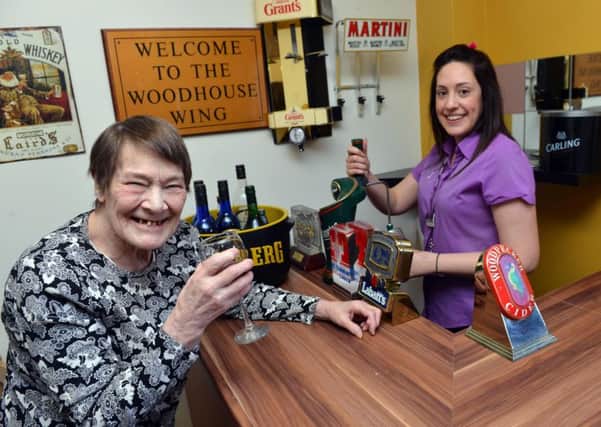Palmersdene Care Home appeal for new home bar. Deputy manager Megan Graves with resident Mary Jordan