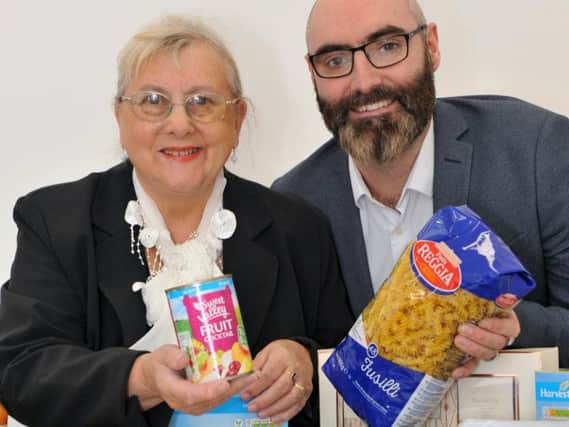 Coun Fay Cunningham and Paul Oliver from Hospitality and Hope with some of the donations