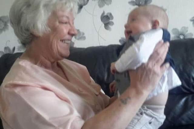 Joan Hoggett with one of her great-grand children