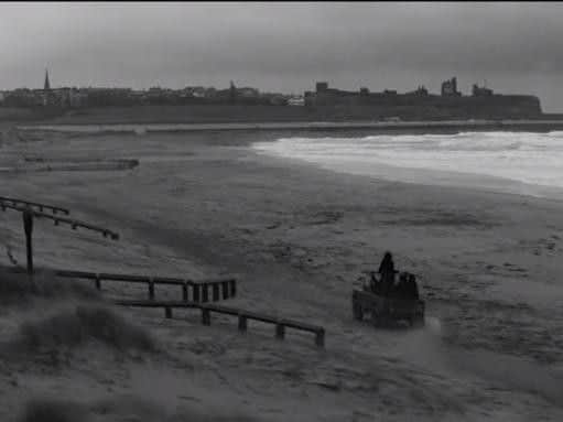 This still from the Catfish and the Bottlemen video shows then heading along the beach in a Land Rover.