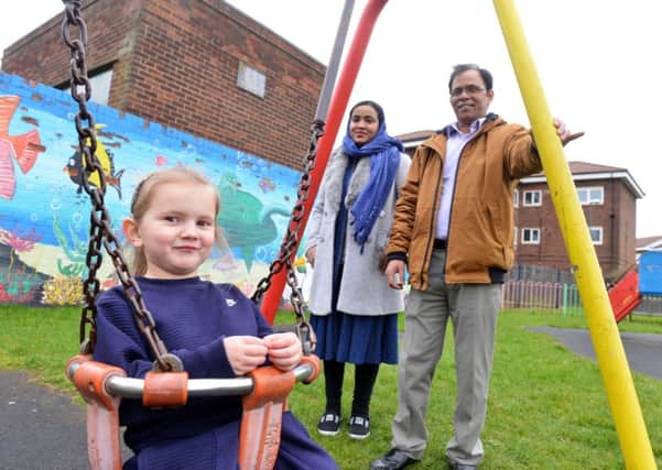 Residents are unhappy on St Marks Play Area condition at Bedford Avenue, Laygate. Ali Hayder with wife Rahima Yesmin and local younster Emelia Graham, 4