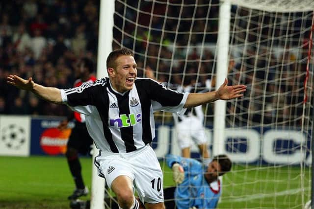 Craig Bellamy celebrates scoring a Champions League goal against Feyenoord.