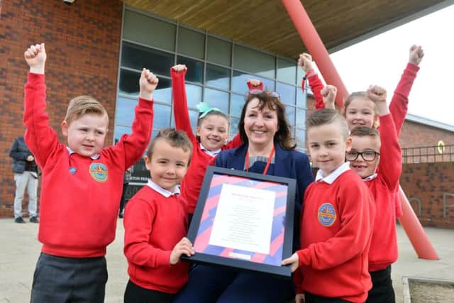 Harton Primary School are winners of the poetry competition. Headteacher Karen Ratcliffe with pupils from left Max,5 Jacob, 5, Darcie, 7, Ethan, 7, Harley, 6 and Ella, 7.