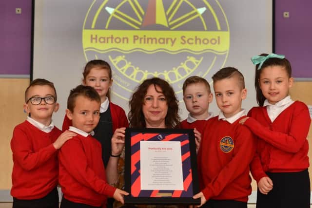 Harton Primary School are winners of the poetry competition. Teacher Stephanie Robson with pupils from left Harley,6, Jacob, 5, Ella, 7, Max, 5, Ethan, 7 and Darcie, 7