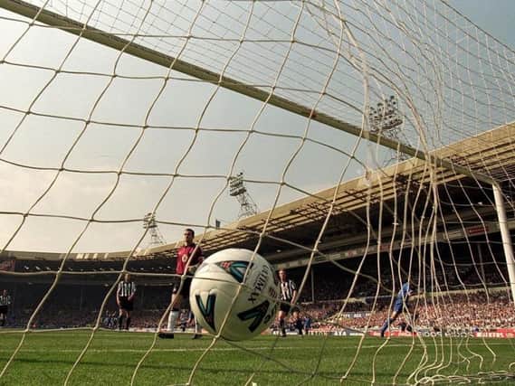 Chelsea's Gus Poyet scores past Newcastle in an FA Cup semi-final at the old Wembley in 2000.