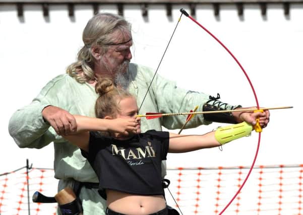Youngster Erin Gatt, nine, has a go at archery at last year's South Tyneside Roman Festival.