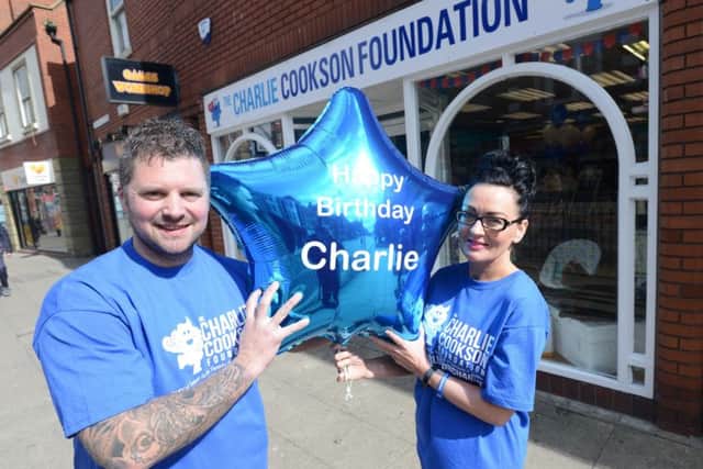 Chris and Sarah Cookson when they opened the charity shop in 2017