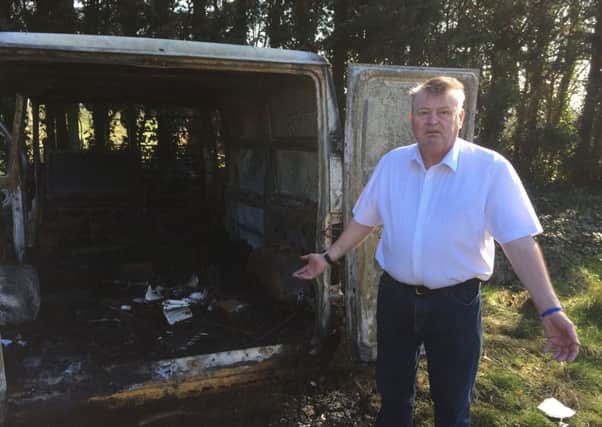 Coun Jeff Milburn with his burned out van