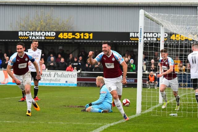 Robert Briggs celebrates scoring against Hednesford.