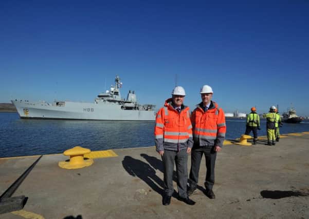 HMS Enterprise arrives alongside UK Dock's Middlesbrough facility, watched by Harry and Jonathan Wilson