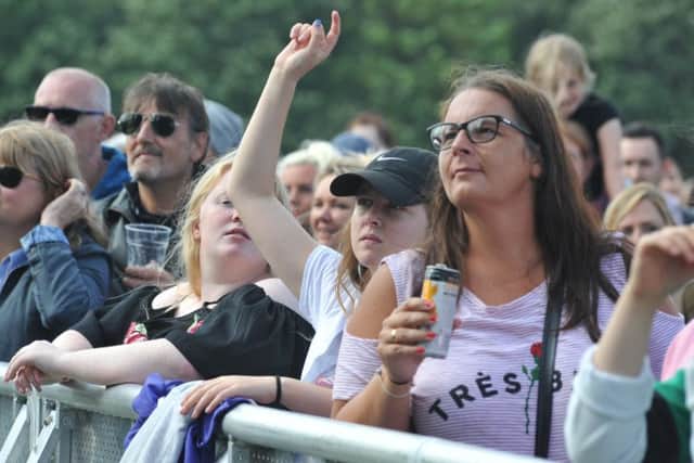 Enjoying a tipple at the concerts.