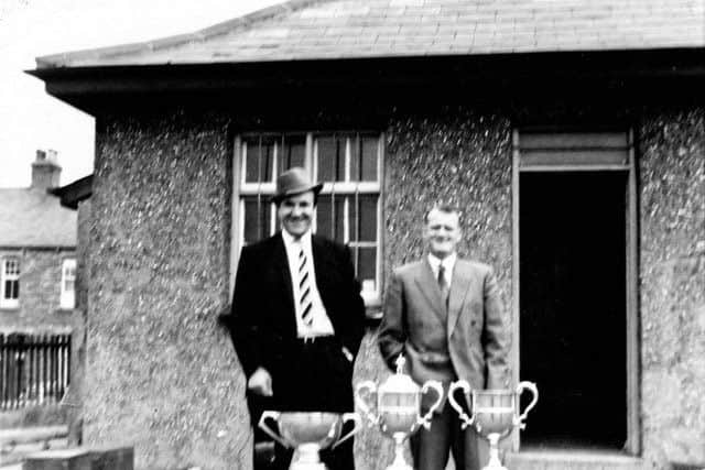 Ron and the McPhersons dad with even more trophies.