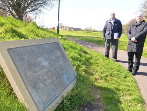 Campaigner Ronnie Mews, left, next to the Temple Park war memorial plaque.