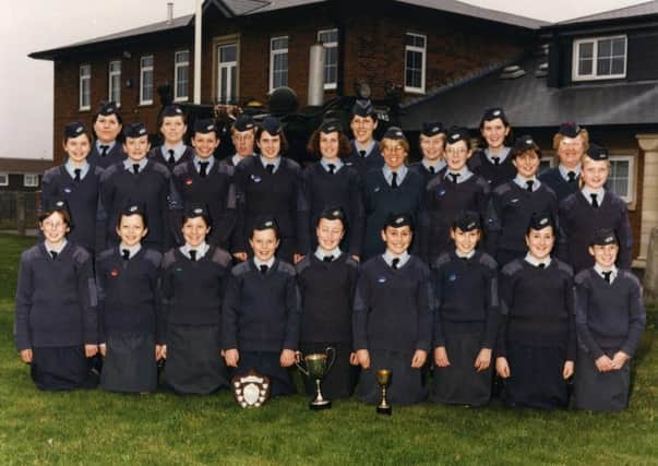 Girls Venture Corps Air Cadets with their certificates and trophies for a variety of achievements in 1997.