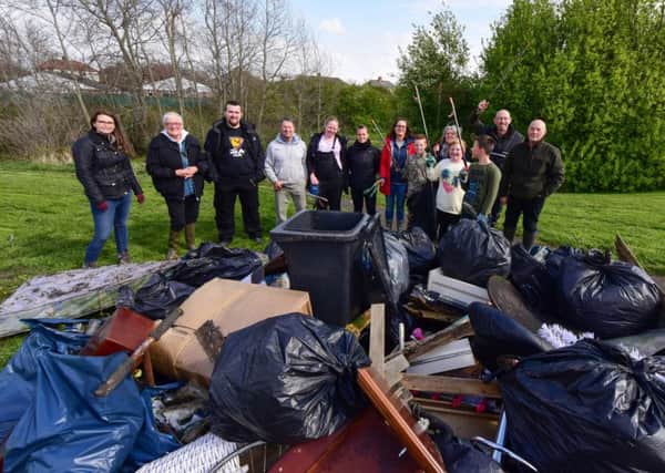 Members of th Tyne Rivers Trust and Monkton Dene Clean groups with the rubbish  rubbish collected at Monkton Burn