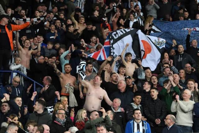 Newcastle fans celebrate at the King Power Stadium.