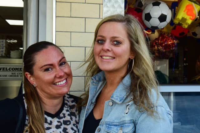 Jessica McGarthy (left) and Rachael Cassidy queueing for fish & chips at Colmans Good Friday in South Shields