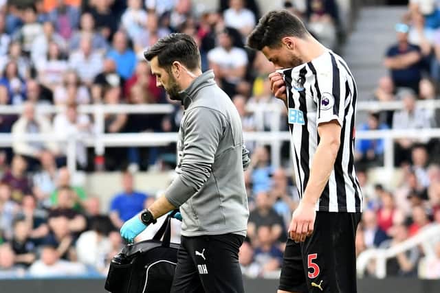 Fabian Schar, right, leaves the field.