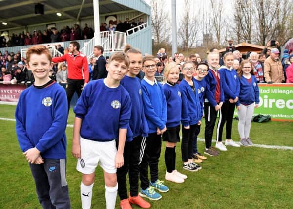 Pupils from Westoe Crown Primary School form a guard of honour at Mariners Park