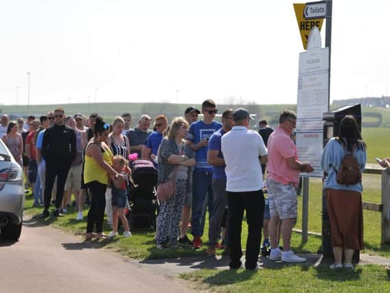 Crowds queuing to pay for parking on The Dragon at Bents Park, South Shields.