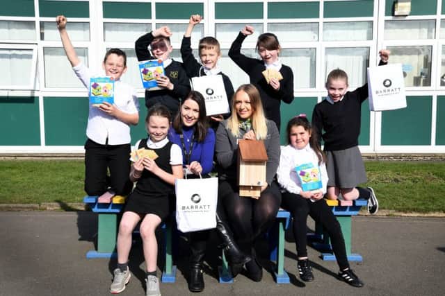 Pupils from Toner Avenue Primary School with their wildlife kits.