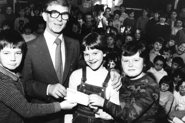 Pupils from Hedworth Lane Junior School, in Boldon Colliery, pictured in  April 1982  who raised money for the National Children's Homes. Presenting the cheque, are left to right, Ian McFarlane, Lisa Winthrop and Christopher Bryden. They gave it  to Kendal Baker, representative for the NCH.