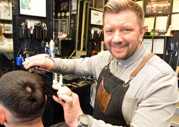 Barber Allan Stone fund raiser for Manchester firefighter Aaron Parmar who is running a 10k race for each person who was killed in the Manchester arena bomb attack in 2017