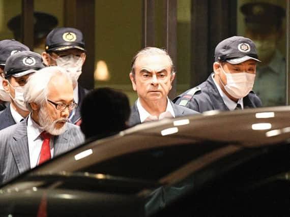 Carlos Ghosn leaves a Japanese detention centre. Picture: PA.