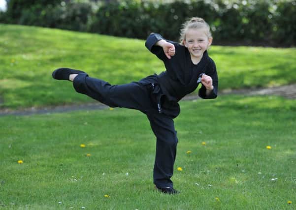 Six-year-old Grace Townsley has been awarded her 1st dan black belt.