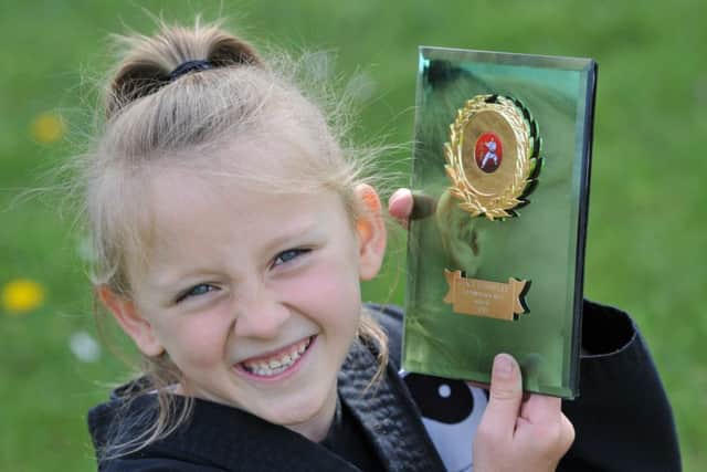 Six year old Grace Townsley has been awarded her 1st Dan Black Belt.