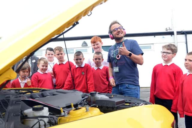 Hedworthfield Primary School pupils take a peak under the car bonnet.