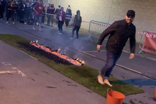 Carl Lowery takes part in the fire walk in honour of the Bradley Lowery Foundation.