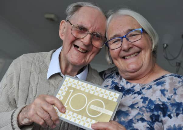 Ken Woods celebrates his 100th birthday, with daughter Susan Key.
