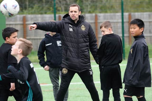 South Shields FC player and Foundation coach Blair Adams directs children at the club's Let's Play Thursday session.