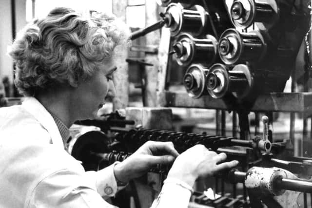 A worker operates a coil winder at the Ferrograph factory in South Shields.