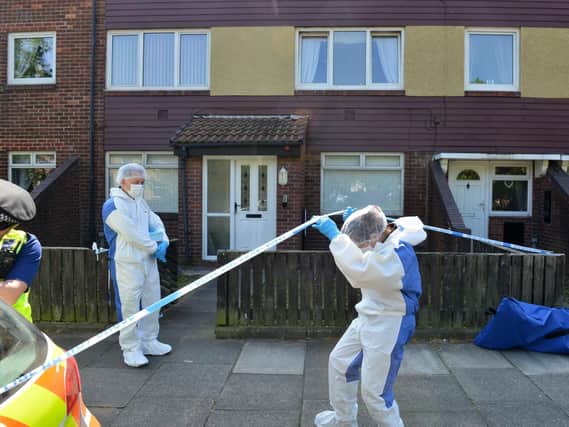 Forensic officers at a house in High Street, Jarrow, after a man's body was discovered on Tuesday.