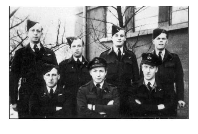 Pilot Flight Lieutenant Kenneth Robinson with his fellow RAF crew.