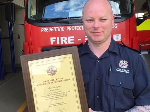 Firefighter Adrian Sargent with his certificate
