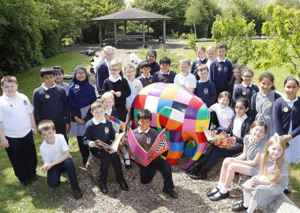 Elmer's Great North Parade begins in August, pupils at Hadrian Primary School with the Elmer the Elephant statue.