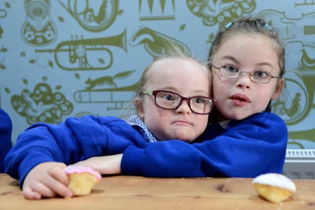 Bambrugh school pupils Scarlett Holmes (5) (left) and Faith Farrand (5) relaxing together. Picture by FRANK REID