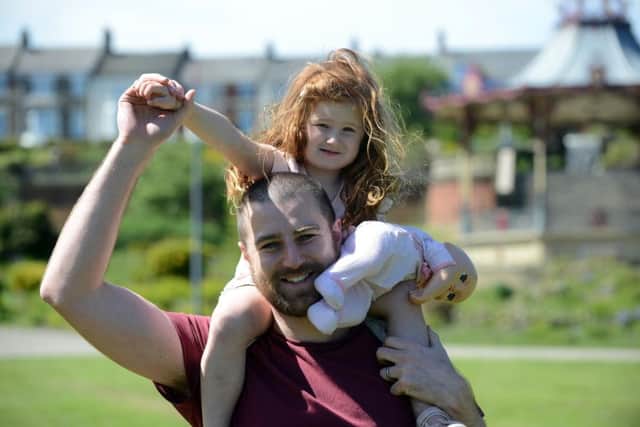Craig Wright and daughter Eve Wright, three, enjoy the high temperatures at South Marine Park.