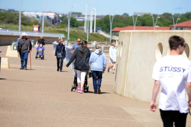 People take in the warm and sunny weather at Littlehaven Beach.