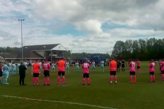 The players and supporters held a minute's applause ahead of the game.