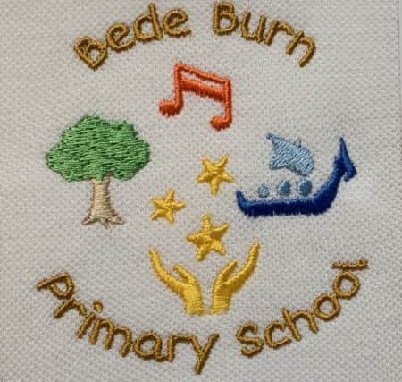 The badge as it will look on the school's polo shirts.